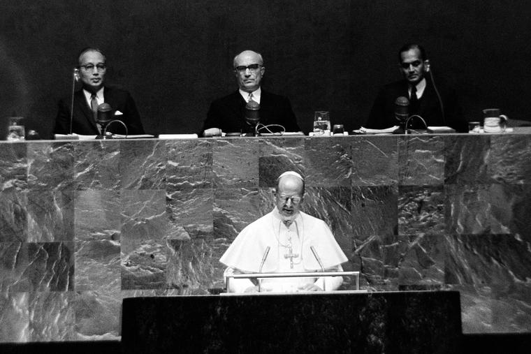 Pope Paul VI addresses to the U.N. General Assembly in New York, Oct. 4, 1965. Seated behind him, from left are: U.N. Secretary General U Thant; General Assembly President Amintore Fanfani and C.V. Narasimhan, U.N. Undersecretary for General Assembly Affairs.