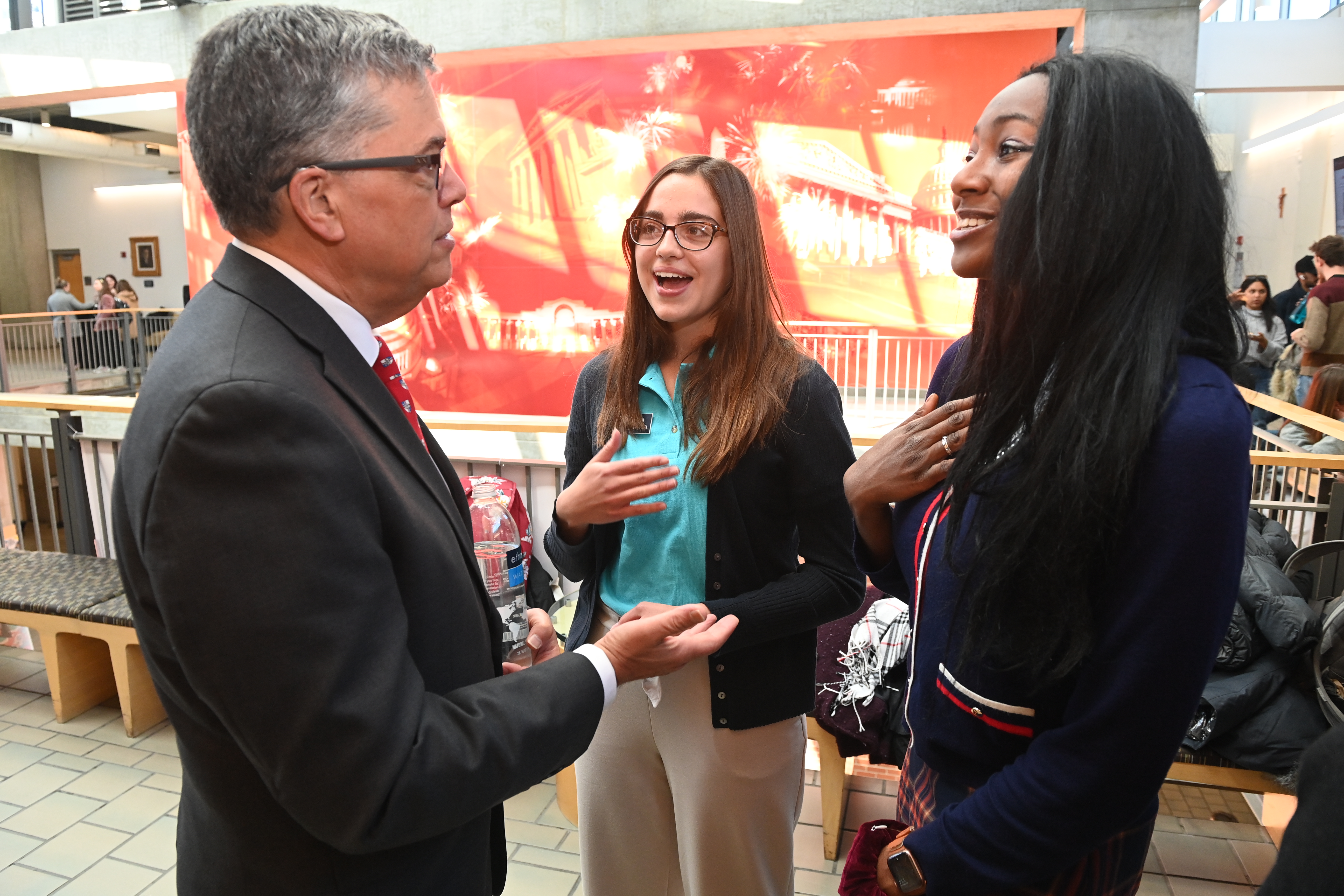 Peter Kilpatrick laughs with students on campus on March 29, 2022.