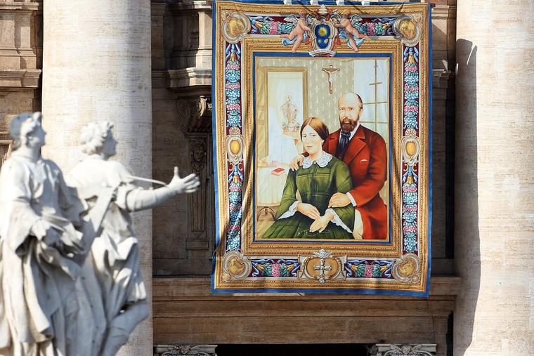 A tapestry featuring the portrait of Sts. Louis and Zélie Martin is draped from the balcony overlooking St. Peter's Square at their canonization on Oct. 18, 2015 in Vatican City.
