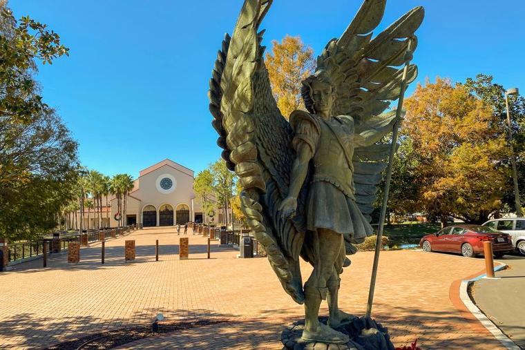 A statue of St. Michael the Archangel is one of several opportunities for outdoor veneration at the Basilica of the National Shrine of Mary, Queen of the Universe in Orlando near the major theme parks.