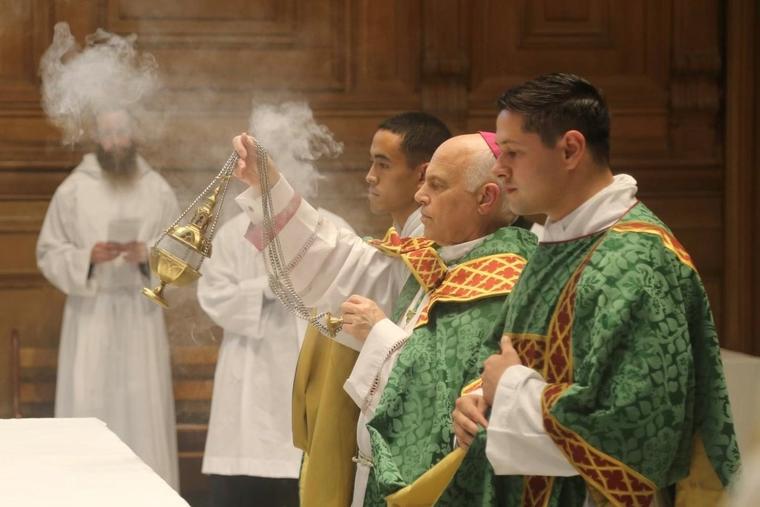 Deacon Matthew Knight, shown in foreground of photo above at prayer with San Francisco Archbishop Salvatore Cordileone, looks forward to priesthood. 