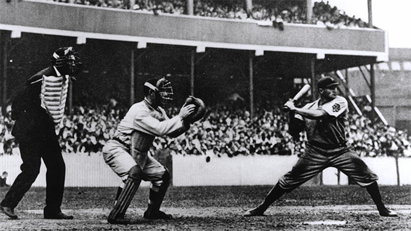 Knights of Columbus Umpire Hank O'Day and New York Giants catcher Roger Bresnahan, both members of the Knights of Columbus, wait for a pitch to Pittsburgh Pirates batter Honus Wagner at New York's Polo Grounds, Sept. 19, 1908. (National Baseball Hall of Fame Library)