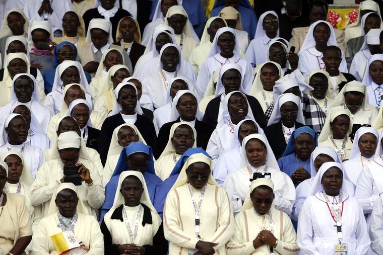 Nuns sing and pray during a Mass celebrated by Pope Francis near the Catholic martyrs' shrine of Namugongo, Kampala, Uganda, Saturday, Nov. 28, 2015. 