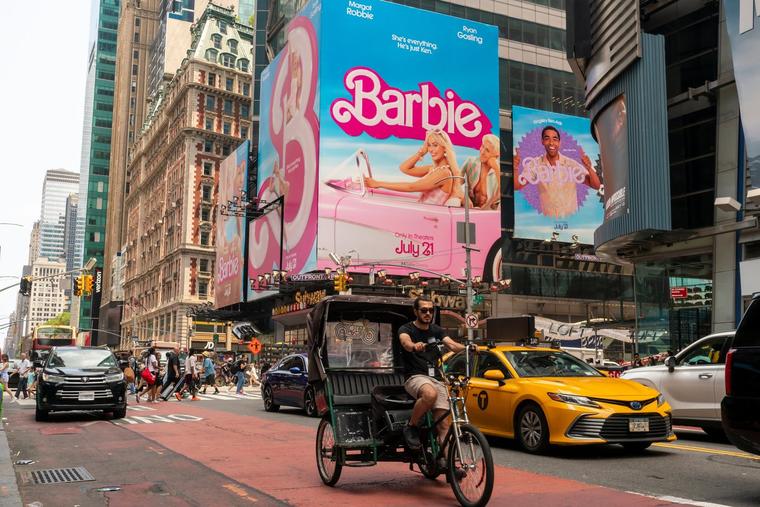 Advertising for the Warner Bros. Pictures Barbie film appears in Times Square in New York.