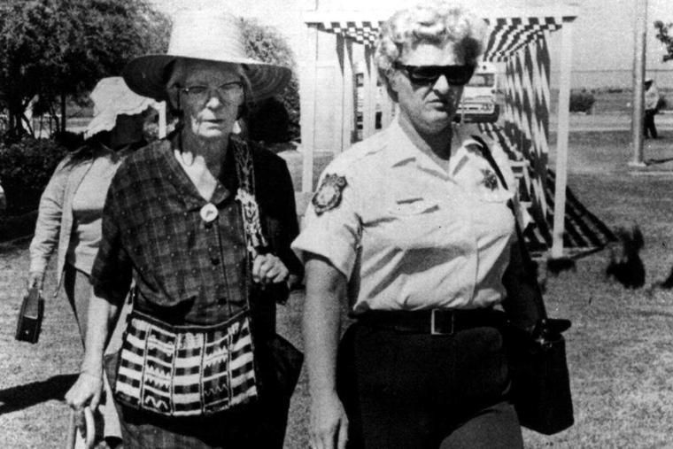 Dorothy  Day, 76-year-old editor of the Catholic Worker, is shown being led of to jail Aug. 10, 1973 at Fresno, Calif. after challenging court limits on United Farm Workers Union picketing a few days earlier.  Miss Day said being jailed here is 'paradise compared to others' she's seen in her half a century of militance.  