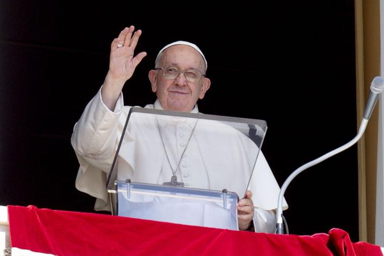 Pope Francis waves to pilgrims gathered in St. Peter's Square for his Angelus reflection on Sept. 10.