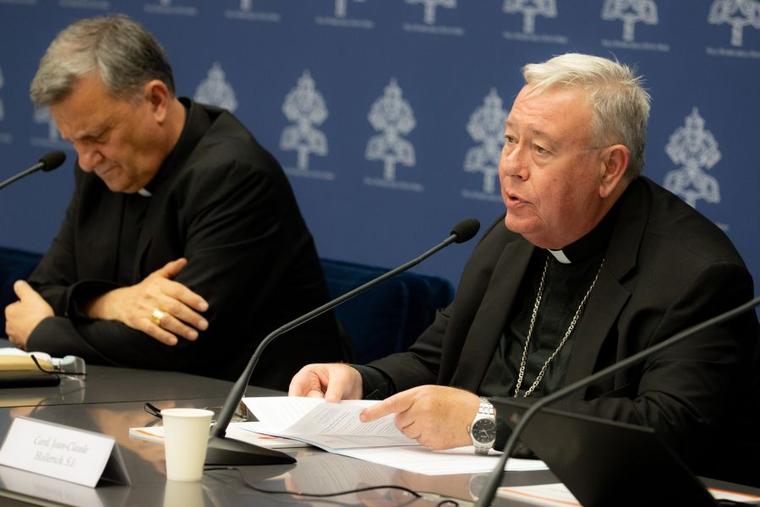 Cardinal Jean-Claude Hollerich (right), relator general of Synod on Synodality, speaks to the media on June 20, 2023, at the temporary headquarters of the Holy See Press Office in Vatican City. Beside him is Cardinal Mario Grech, the Secretary General for the Synod of Bishops.