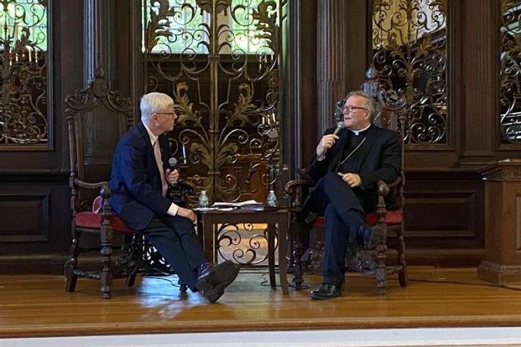 Bishop Robert Barron of Winona-Rochester, Minnesota, with Deacon Tim O'Donnell to his left, answers questions from the crowd following his ‘The Catholic Intellectual Tradition’ lecture at Harvard University on Sept. 17.