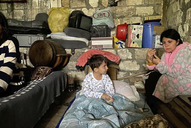 Children are in a shelter during shelling in Stepanakert in Nagorno-Karabakh, Azerbaijan Wednesday, Sept. 20, 2023. 