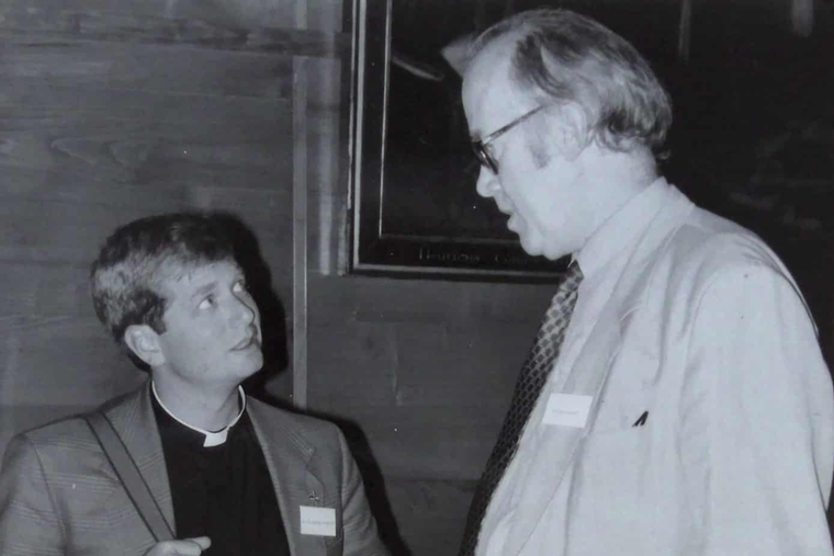 Archbishop Anthony Fisher chats with professor Luke Gormally in the 1980s.